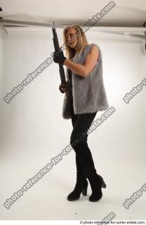 12 2018 01 NIKOL STANDING POSE WITH SHOTGUN